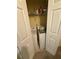 Laundry closet with washer and dryer; wire shelving for storage at 6550 Wellington Chase Ct, Lithonia, GA 30058
