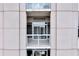 A close-up of a balcony featuring sliding glass doors with white trim at 2881 Peachtree Ne Rd # 1202, Atlanta, GA 30305