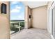 Outdoor balcony with concrete tiles and views of treetops and buildings at 2881 Peachtree Ne Rd # 1202, Atlanta, GA 30305