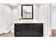 Bright bathroom with a modern vanity, vessel sink, and a large framed mirror with a nearby toilet at 2881 Peachtree Ne Rd # 1202, Atlanta, GA 30305