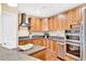 Modern kitchen featuring stainless steel appliances, granite countertops, and wooden cabinets at 2881 Peachtree Ne Rd # 1202, Atlanta, GA 30305