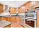 Well-lit kitchen features stainless steel appliances, granite countertops, and beautiful wooden cabinets at 2881 Peachtree Ne Rd # 1202, Atlanta, GA 30305