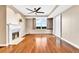 Bright living room with hardwood floors, a fireplace, and natural light from window at 2881 Peachtree Ne Rd # 1202, Atlanta, GA 30305