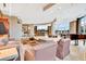 A bright living room with a piano, wet bar, comfortable seating, and views of the city at 2881 Peachtree Ne Rd # 1202, Atlanta, GA 30305