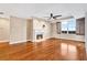Elegant living room featuring hardwood floors, a fireplace, and window views with open shutters at 2881 Peachtree Ne Rd # 1202, Atlanta, GA 30305