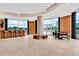 A well lit living room features a wet bar, comfortable seating, travertine floors, and views of the city at 2881 Peachtree Ne Rd # 1202, Atlanta, GA 30305