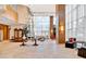 Spacious lobby area featuring elegant lighting fixtures, plants, and modern furniture at 2881 Peachtree Ne Rd # 1202, Atlanta, GA 30305