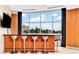 A modern wet bar features comfortable seating and city views at 2881 Peachtree Ne Rd # 1202, Atlanta, GA 30305