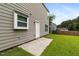 Exterior view of the house with a well-maintained lawn at 3915 Cypress Pointe Dr, Union City, GA 30291