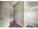Neutral bathroom with a walk-in shower, vanity, and wood floors at 3915 Cypress Pointe Dr, Union City, GA 30291