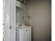 Powder room featuring a white vanity and neutral wall color at 3915 Cypress Pointe Dr, Union City, GA 30291