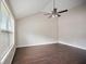 Spacious bedroom featuring hardwood floors, a ceiling fan, and natural lighting at 3915 Cypress Pointe Dr, Union City, GA 30291