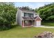 Charming two-story home with brick and vinyl siding and attached one car garage at 3915 Cypress Pointe Dr, Union City, GA 30291