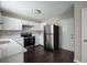 Well-equipped kitchen with stainless steel appliances, white cabinets, and countertops at 3915 Cypress Pointe Dr, Union City, GA 30291