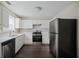 Well-equipped kitchen with stainless steel appliances, white cabinets, and countertops at 3915 Cypress Pointe Dr, Union City, GA 30291