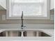Stainless steel kitchen sink with modern faucet and a bright window at 3915 Cypress Pointe Dr, Union City, GA 30291