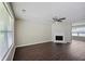 Spacious living room with hardwood floors, fireplace, and ceiling fan at 3915 Cypress Pointe Dr, Union City, GA 30291