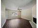Spacious living room with hardwood floors, fireplace, and ceiling fan at 3915 Cypress Pointe Dr, Union City, GA 30291