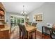Dining room featuring hardwood floors, stylish furniture, and ample natural light at 405 Forest Valley Road, Sandy Springs, GA 30342