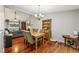 Open dining area with hardwood floors and view of the living area at 405 Forest Valley Road, Sandy Springs, GA 30342