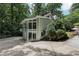 Multi-story home with expansive windows surrounded by lush landscaping at 405 Forest Valley Road, Sandy Springs, GA 30342
