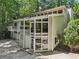 Unique modern home featuring expansive windows and a two-car garage with a fenced-in yard at 405 Forest Valley Road, Sandy Springs, GA 30342