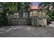 Charming contemporary home boasting large windows and a spacious two-car garage at dusk at 405 Forest Valley Road, Sandy Springs, GA 30342