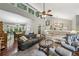 Bright and spacious living room with vaulted ceilings, hardwood floors, and a ceiling fan at 405 Forest Valley Road, Sandy Springs, GA 30342