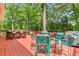 Inviting back deck with multiple seating areas, perfect for outdoor dining and relaxation surrounded by lush greenery at 621 Windgrove Se Rd, Marietta, GA 30067