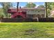 View of the backyard showing a brick retaining wall and stairs leading to a deck at 621 Windgrove Se Rd, Marietta, GA 30067