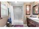 Bathroom with a tub and shower combination, framed artwork, and a decorative vanity at 621 Windgrove Se Rd, Marietta, GA 30067