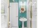 Charming bathroom with a pedestal sink, decorative mirror, and a tiled shower at 621 Windgrove Se Rd, Marietta, GA 30067