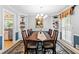 Bright dining room featuring built-in cabinets, hardwood floors, and large window at 621 Windgrove Se Rd, Marietta, GA 30067