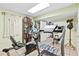 Dedicated workout room with treadmill, stationary bike, and tile floors, ready for your fitness routine at 621 Windgrove Se Rd, Marietta, GA 30067