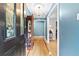 Inviting foyer with hardwood floors, chandelier, and blue painted walls at 621 Windgrove Se Rd, Marietta, GA 30067
