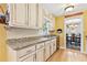 Kitchen with granite countertops, stainless steel appliances, and painted cabinets at 621 Windgrove Se Rd, Marietta, GA 30067
