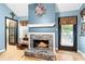 Living room showcasing cozy fireplace, hardwood floors, and walkout to outdoor space at 621 Windgrove Se Rd, Marietta, GA 30067