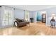 Cozy living room featuring hardwood floors, daybed, and lots of natural light at 621 Windgrove Se Rd, Marietta, GA 30067