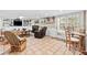 Cozy living room with fireplace, built-in shelving, tile flooring, and sliding doors to the outside at 621 Windgrove Se Rd, Marietta, GA 30067