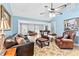 Open living room with hardwood floors, fireplace, large furniture, and lots of natural light at 621 Windgrove Se Rd, Marietta, GA 30067