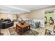 Spacious living room with tile floors, comfortable seating, area rug, and access to an adjacent room at 621 Windgrove Se Rd, Marietta, GA 30067