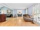 Bright living room featuring hardwood floors, blue walls, and large windows at 621 Windgrove Se Rd, Marietta, GA 30067