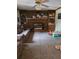 Comfortable living room featuring a brick fireplace and built-in bookshelves at 938 Lost Valley Se Dr, Conyers, GA 30094