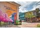 Welcome to Olde Town depicted with colorful architecture and murals on a brick street at 938 Lost Valley Se Dr, Conyers, GA 30094
