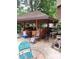 Outdoor kitchen with lots of counter space, storage and a bar at 938 Lost Valley Se Dr, Conyers, GA 30094