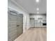 Finished basement with a kitchenette featuring gray cabinets and stainless steel appliances at 1294 Six Sisters St, Dacula, GA 30019