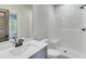 This bathroom features a shower, toilet, and vanity at 1294 Six Sisters St, Dacula, GA 30019