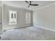 Neutral bedroom with carpet and multiple windows for natural light at 1294 Six Sisters St, Dacula, GA 30019