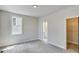 Bright bedroom with carpet and natural light. The bedroom offers an ensuite bathroom and walk-in closet at 1294 Six Sisters St, Dacula, GA 30019