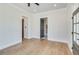 Bedroom with hardwood floors and doorway at 1294 Six Sisters St, Dacula, GA 30019